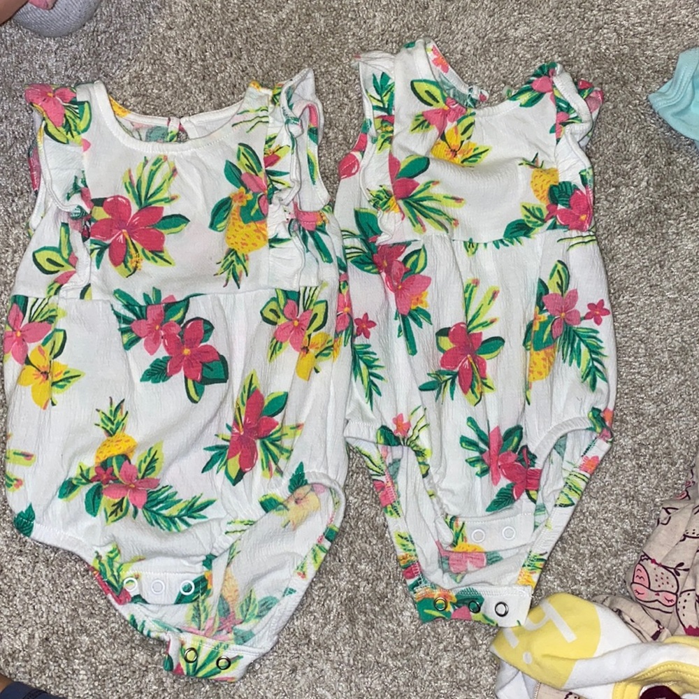 Two baby onesies